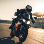 Motorcycle rider on the race track. Close-up of sport bike. Extreme athlete Sport Motorcycles Racing, AI Generated